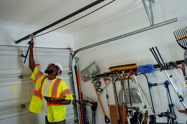 Professional Garage Door Panel Replacement technician working in Tuskegee, AL